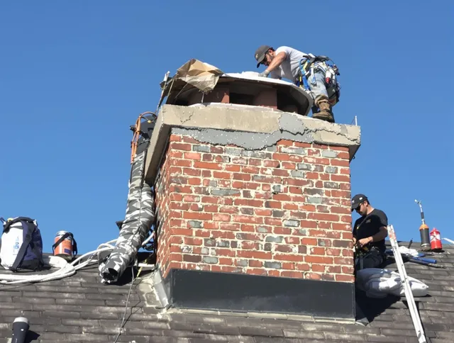 Country Club Chimney Sweep installing a custom chimney crown in Country Club, FL